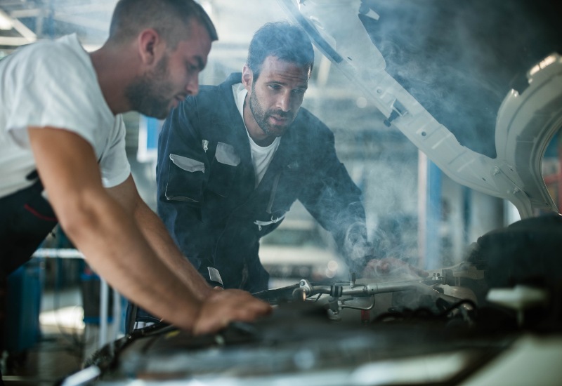 Red River Oil Company Mechanics Inspecting an Engine of a Truck in Texas and Arkansas