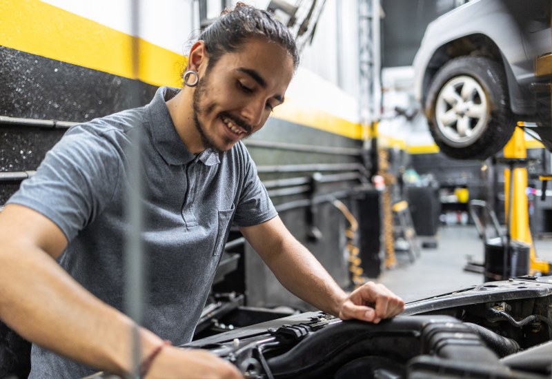 Mechanic Working on an Overheated Engine in Texas and Arkansas